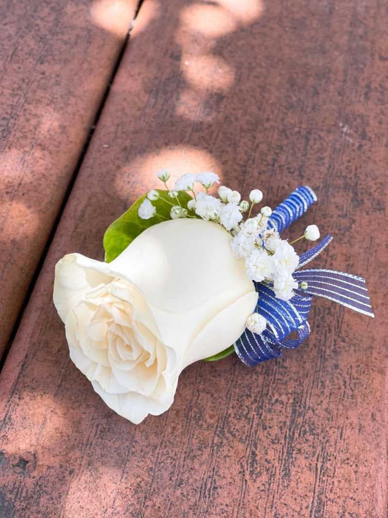 Boutonniere (White Rose & Blue + Silver Ribbon)